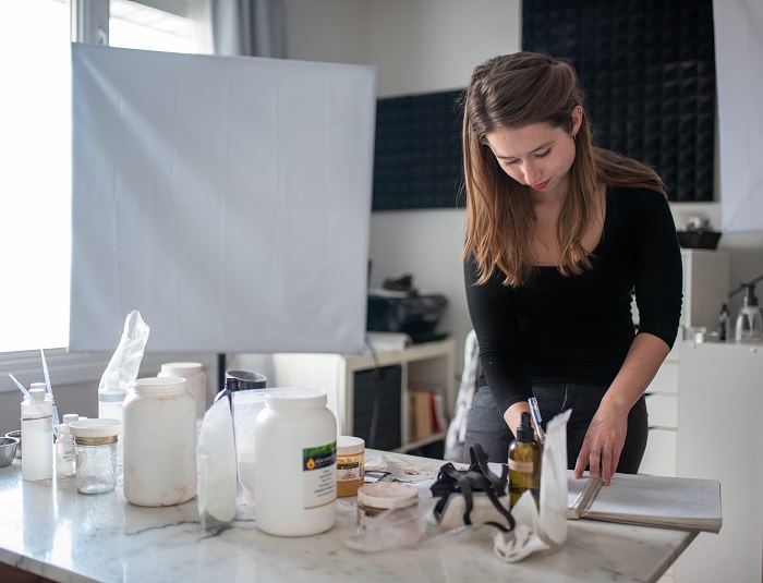 Marie Rayma working in her studio