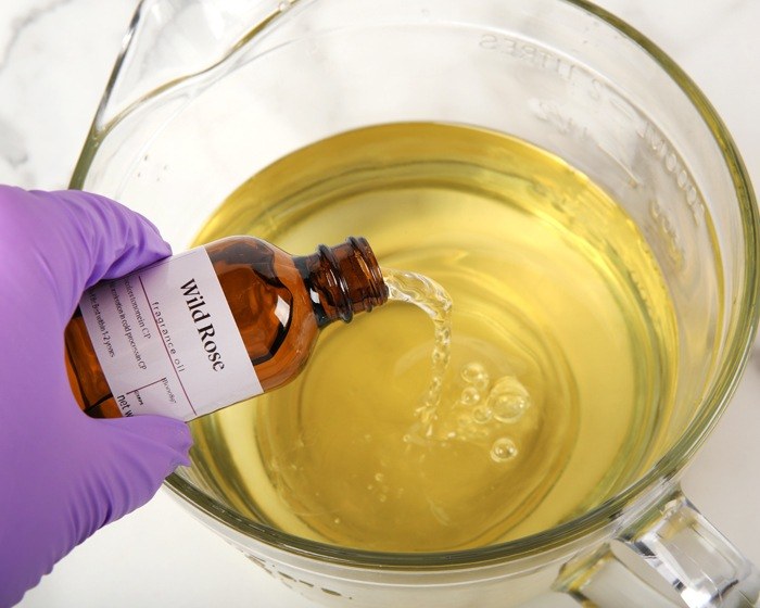 pouring fragrance into melted wax |
                bramble berry