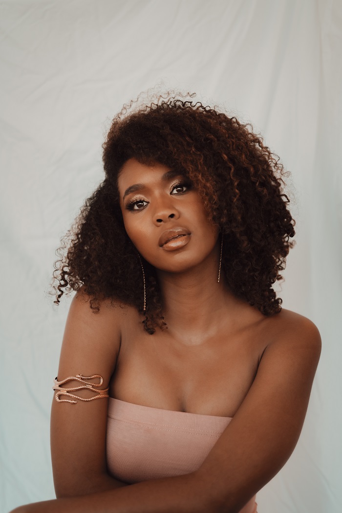 A black woman with natural hair A
black woman with natural hair