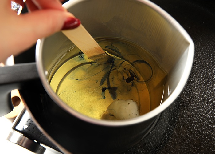 add candle
colorant to wax