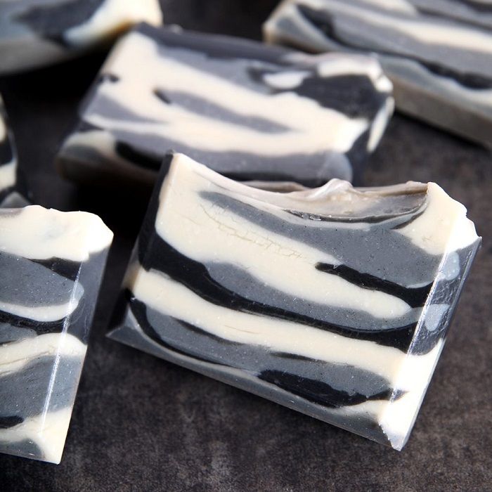 Patchouli Bentonite Soap Project Bars of soap with white, grey, and black swirls
