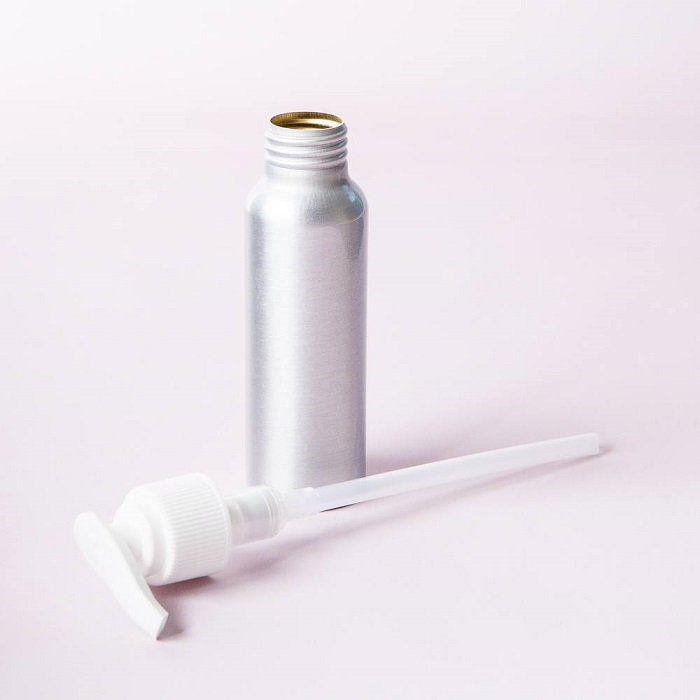 Brushed aluminum finish pump top bottle