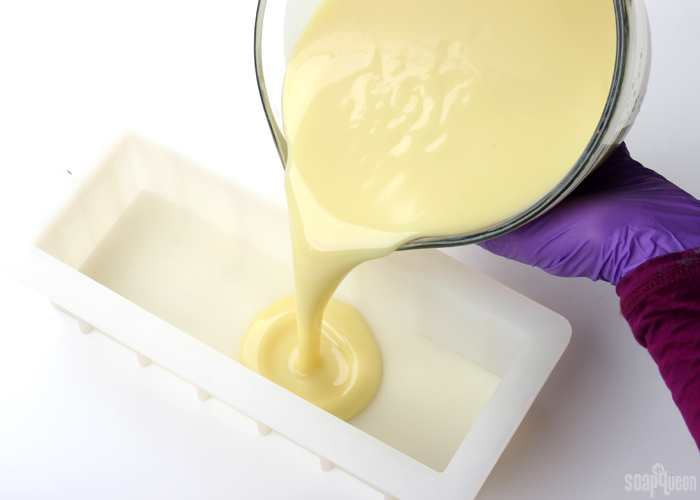Pouring cold process soap into a brambleberry mold