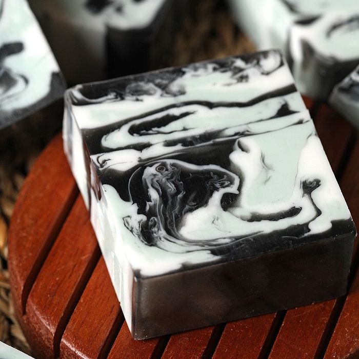 Black and
                white soap poured in a loaf mold