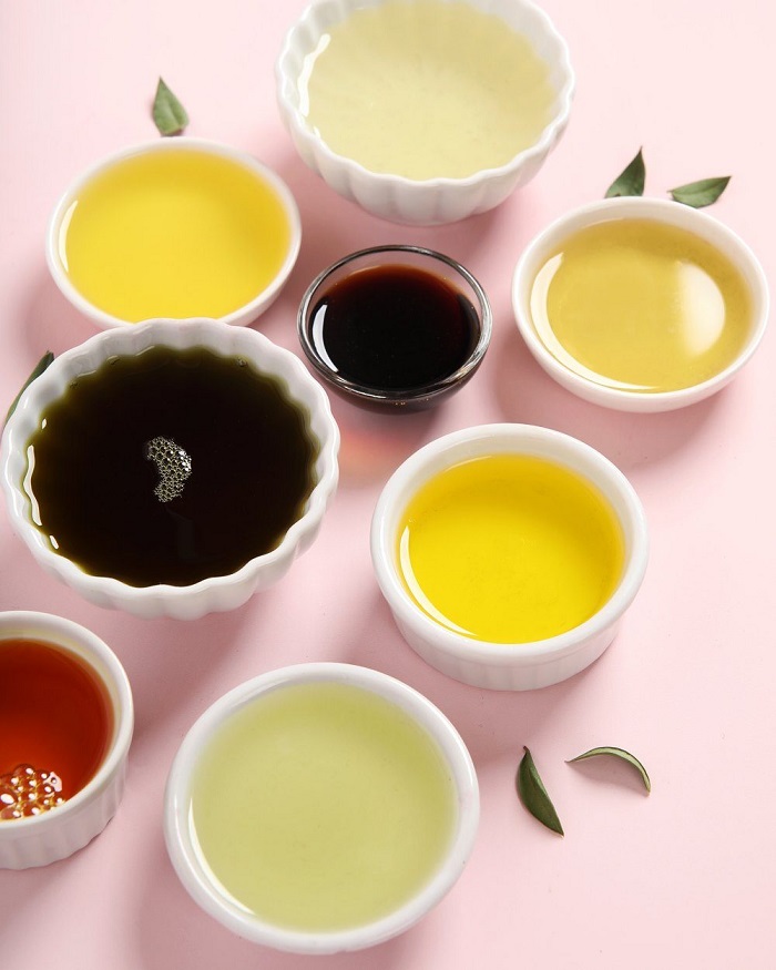 A variety of soap making oils in bowls