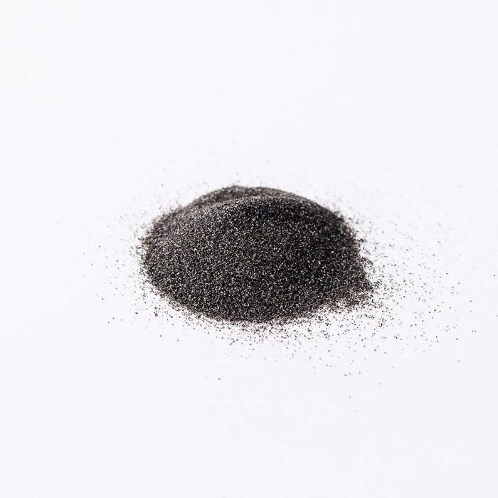 Icelandic Black Sand A small pile of black sand on a white
background